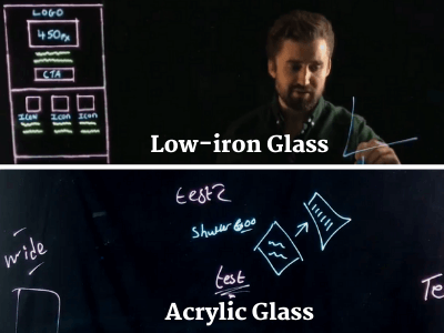 Side-by-side comparison: low-iron glass keeps the presenter and writing bright and clear, while acrylic glass looks hazy with visible smudges and leftover marker residue