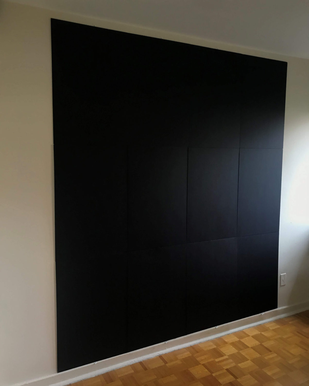 Black backdrop panels viewed from front left