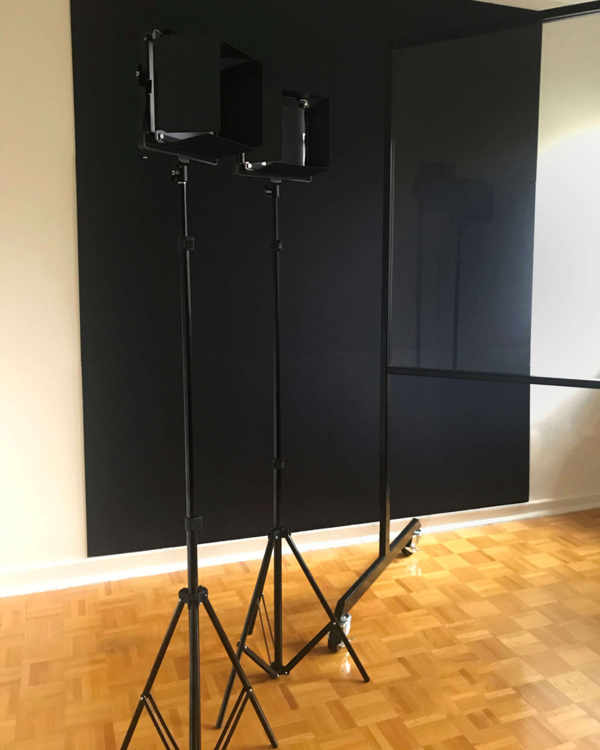 Studio lights from the side with black backdrop and lightboard