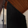 Standalone black backdrop fabric product side view close up